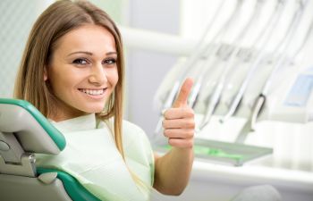 Satisfied patient in a dental chair