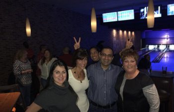 Drs. Azita and Michael Mansouri with friends at the bowling alley