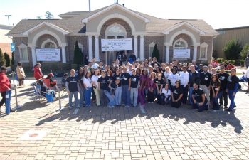 “Free Dental Day” team in front of the clinic building