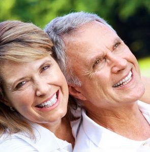 Two older smiling people